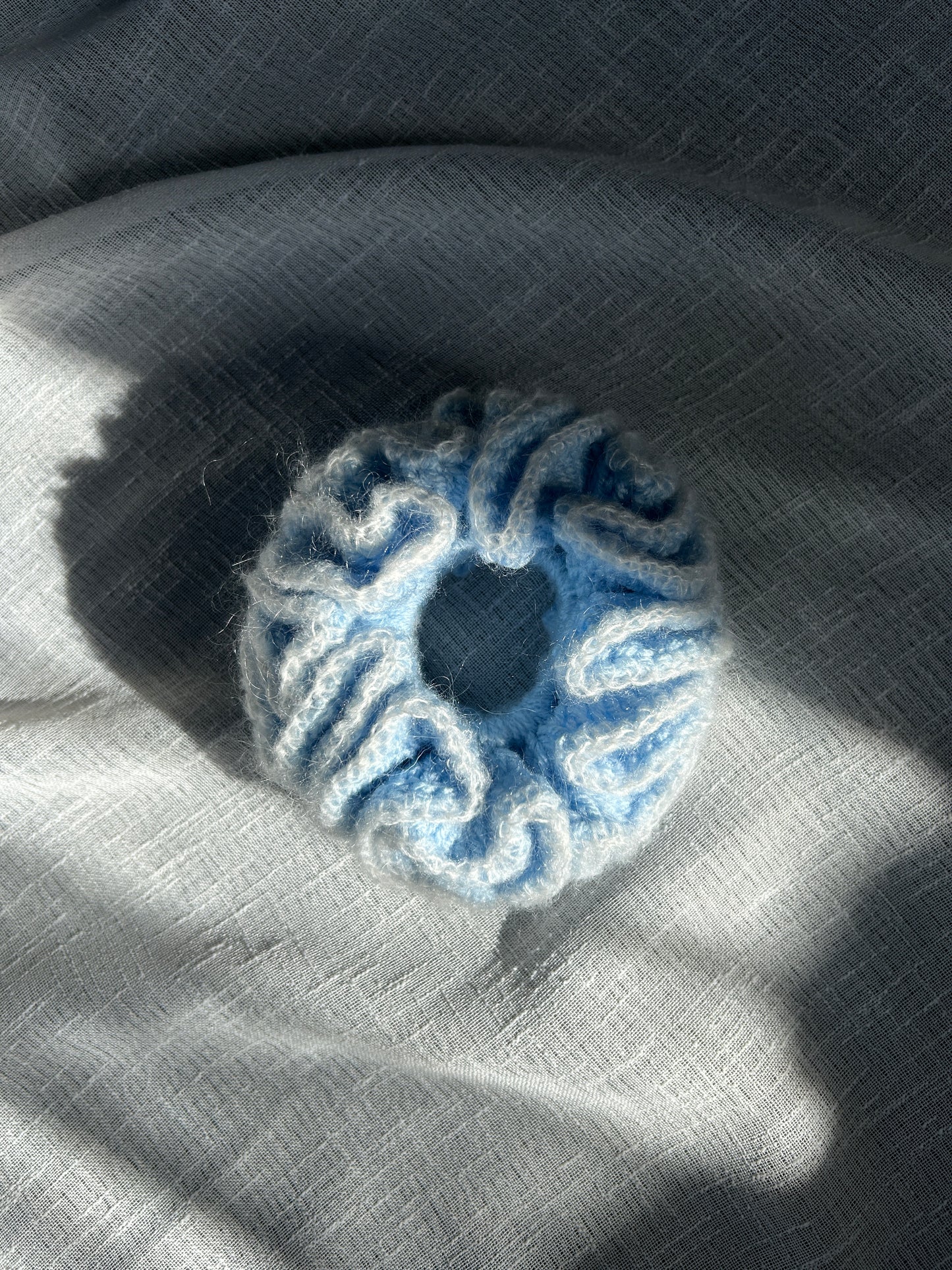 sky blue crochet scrunchy with frilly white trim