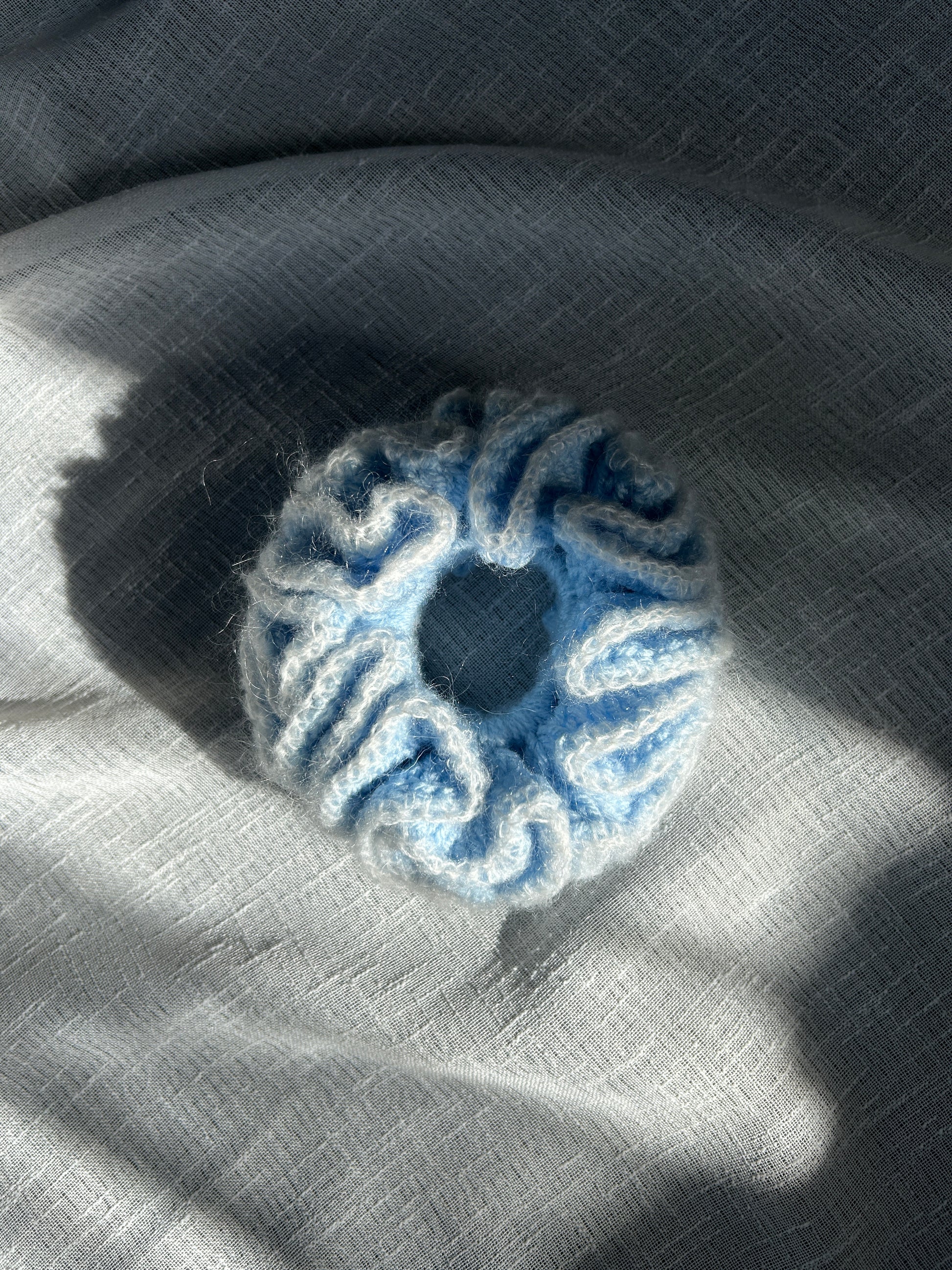 sky blue crochet scrunchy with frilly white trim